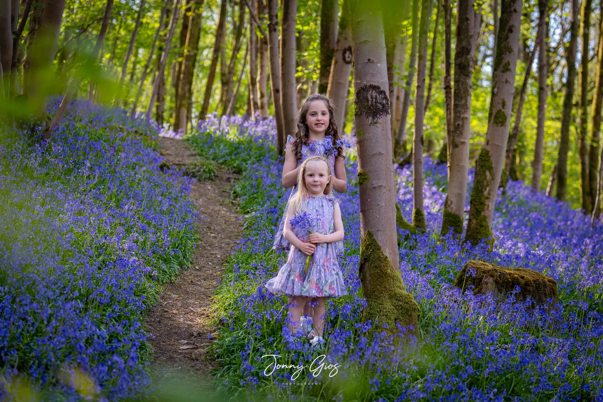 jonny gios kids in the bluebells on a hill