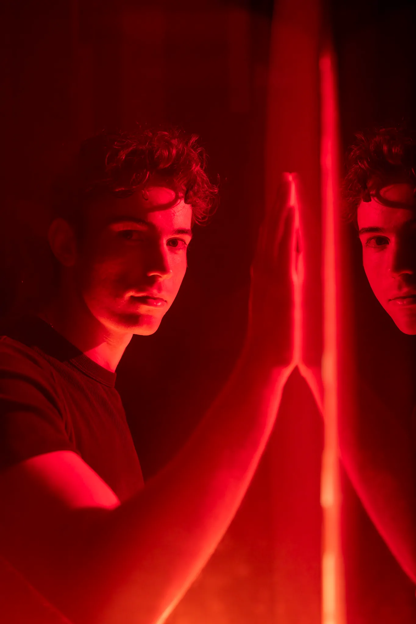 man lit with neon in soho