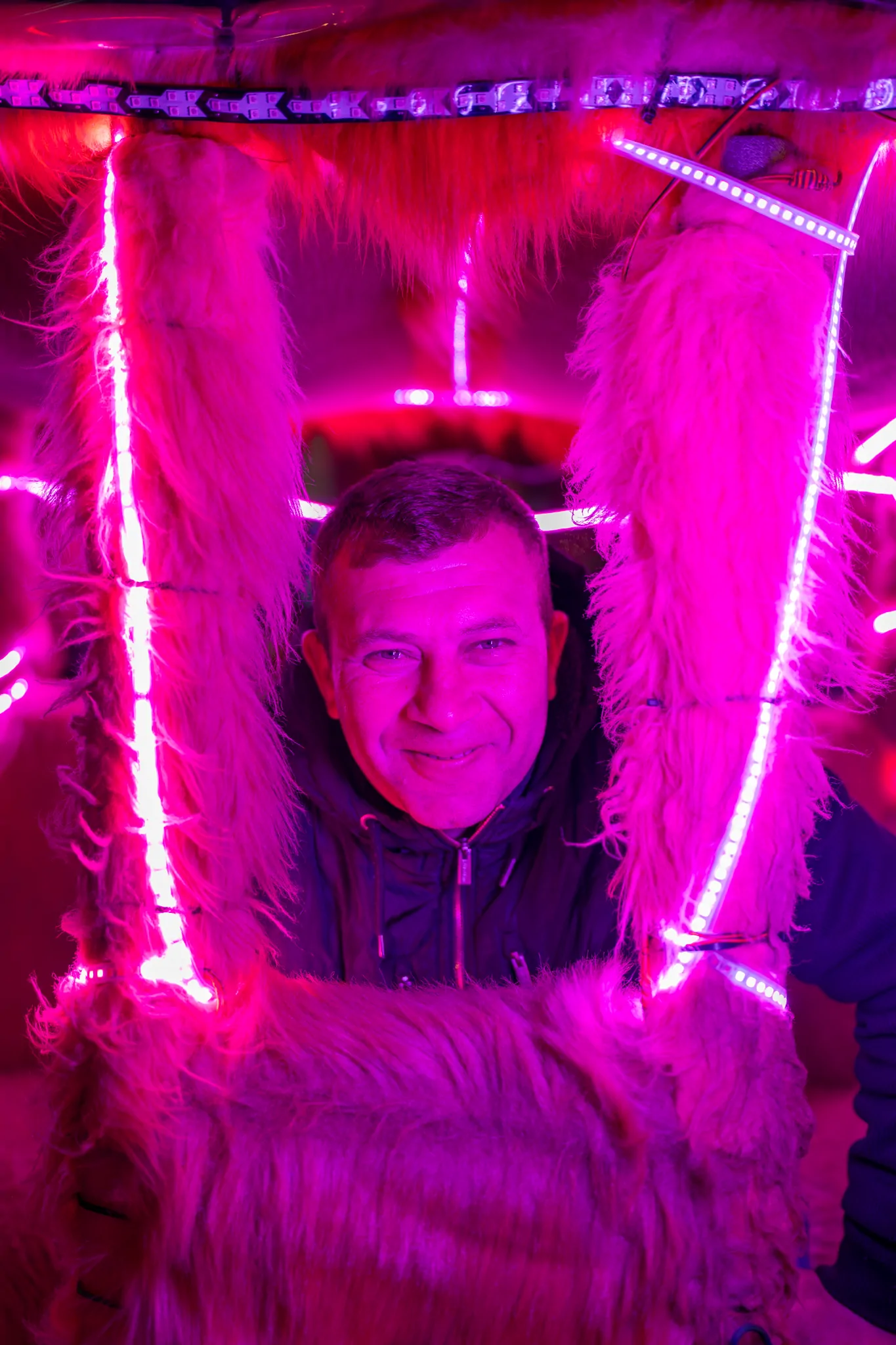 man lit in purple neon