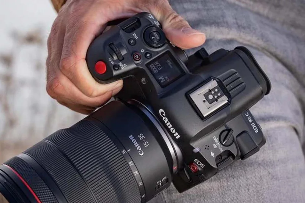 Canon EOS R5 C front view with RF lens, designed for 8K video and hybrid shooting