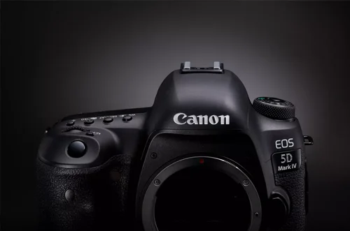 Professional DSLR camera from Canon or Nikon with large sensor and optical viewfinder