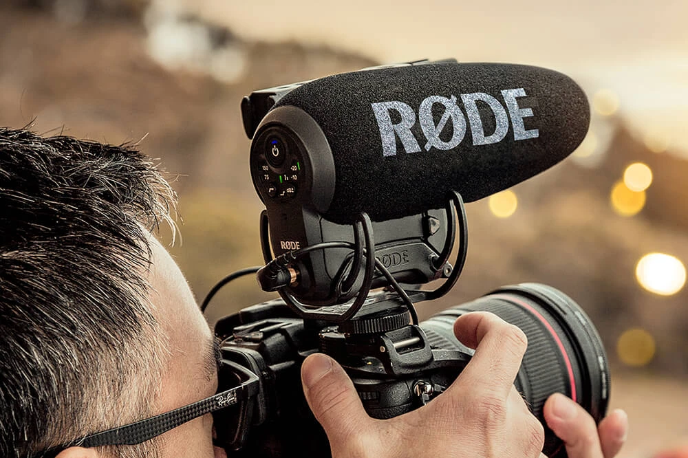 Compact on-camera microphone mounted on DSLR for mobile video production