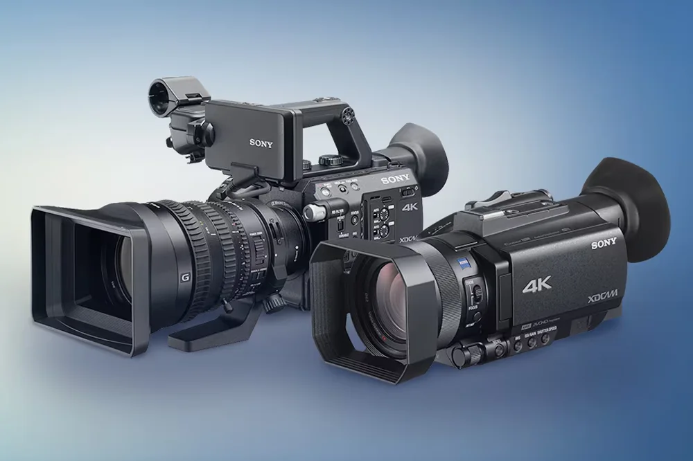 Two Sony handheld 4K camcorders side by side, showcasing different body styles and lens configurations