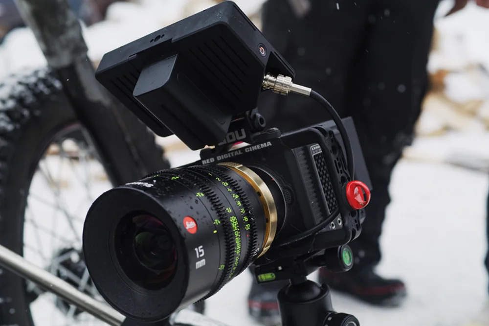 RED Komodo 6K cinema camera rigged with a Leica 15mm lens, filming outdoors in snowy conditions