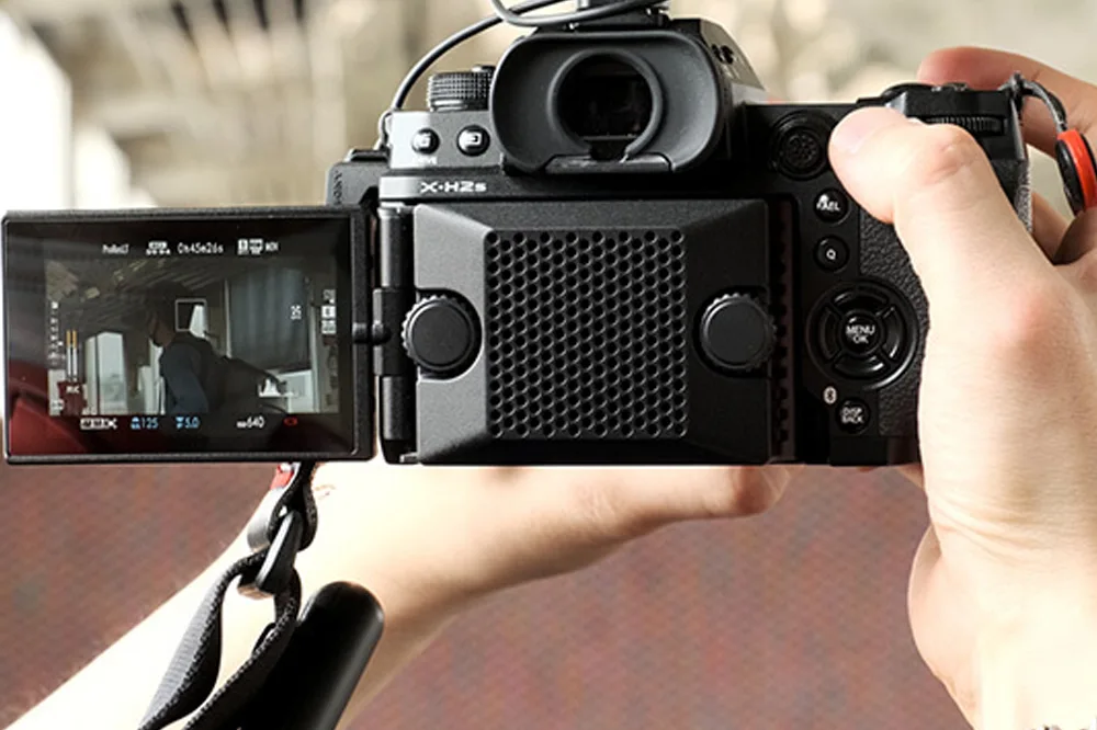 Fujifilm X Series mirrorless camera with prime lens and retro design